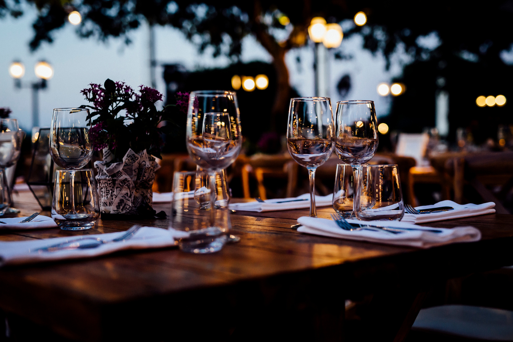 Luxury table settings for fine dining with and glassware, beautiful blurred  background. For events, weddings.